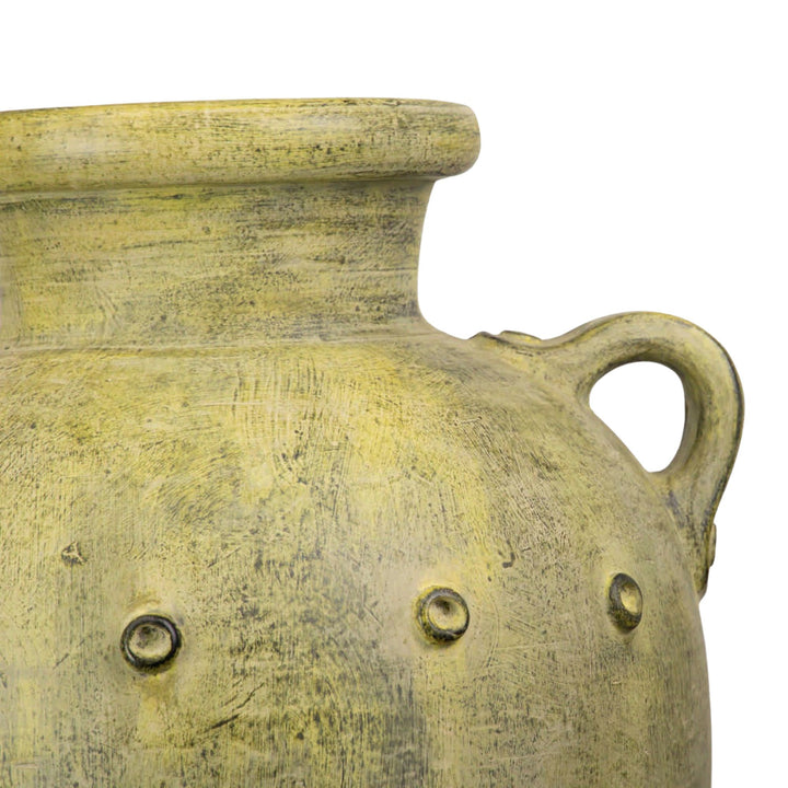 Close-up detail of the vase’s handles and distressed terracotta texture.