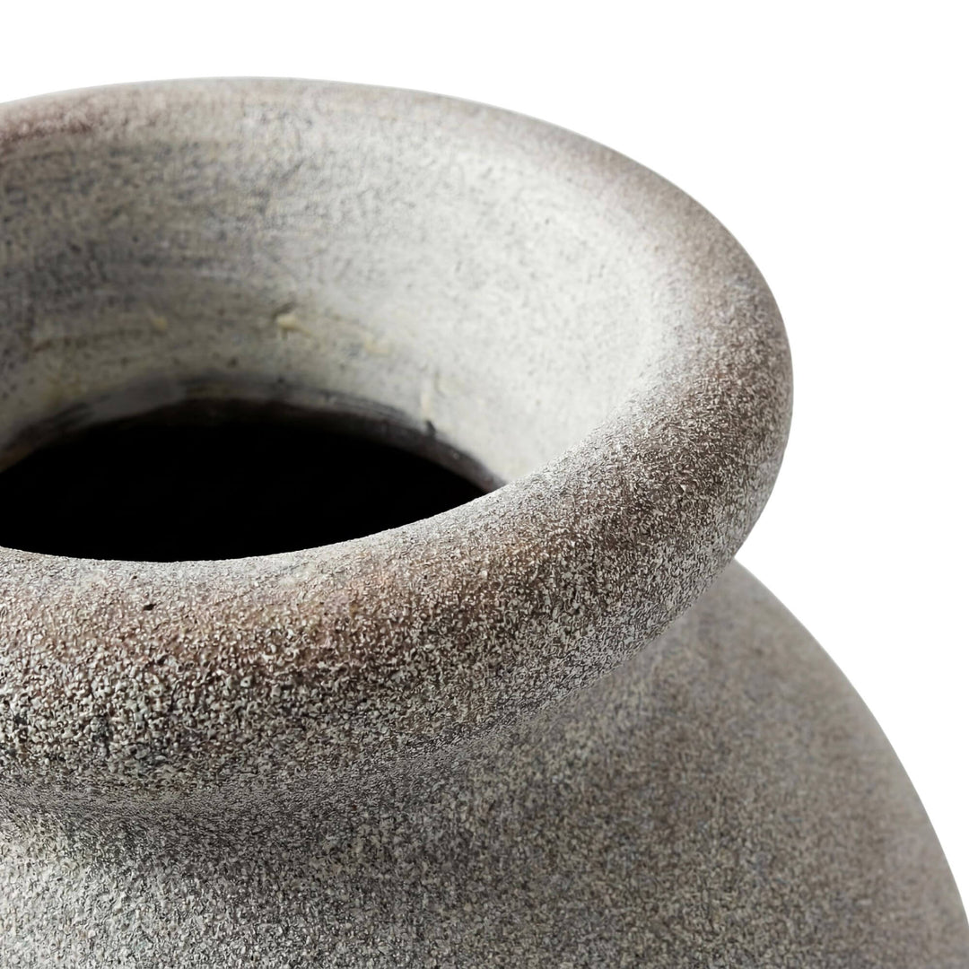 Close-up of the vase opening and softly weathered rim finish.