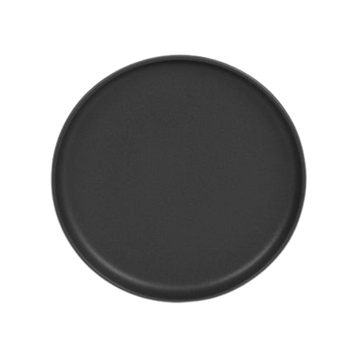 Top view of black ceramic plate with smooth matte surface.