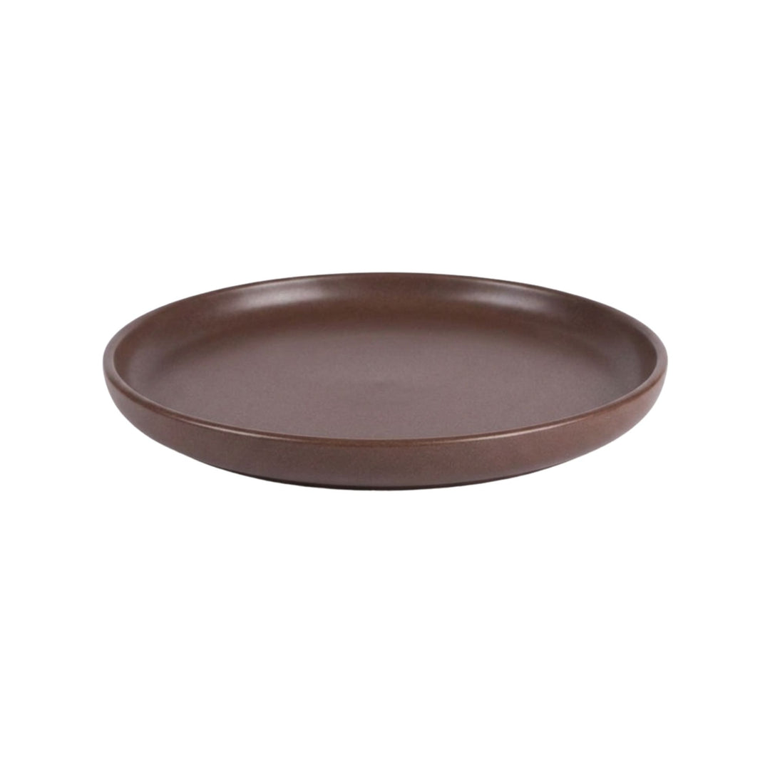 Side view of chocolate brown ceramic plate with smooth matte finish.