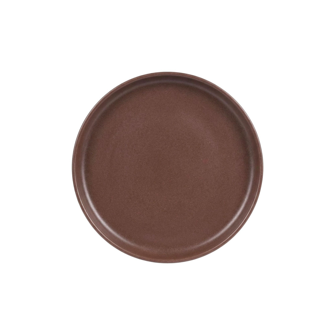 Top view of chocolate brown ceramic dessert plate with smooth matte finish.