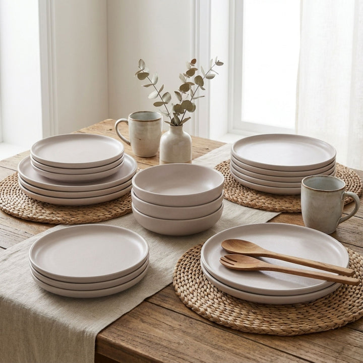 Uno Cream tableware styled on a dining table with neutral textiles and wooden accents.