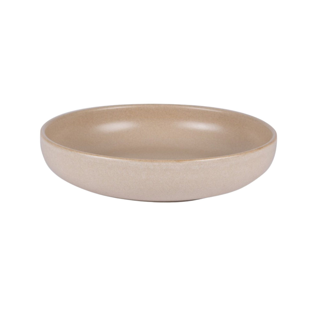 Side view of Uno Sand ceramic bowl highlighting its clean shape and warm tone.