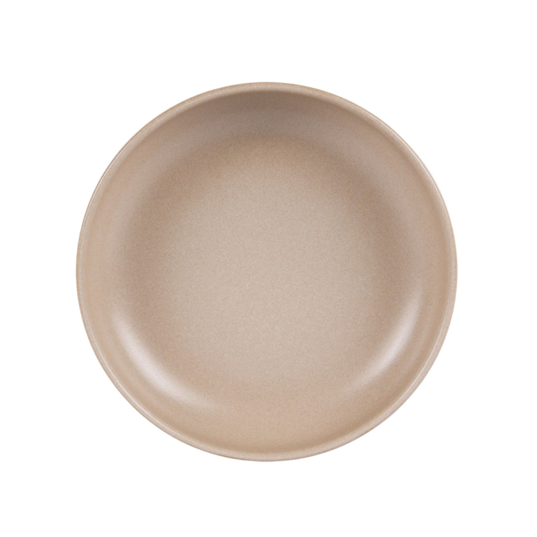 Top view of Uno Sand ceramic bowl highlighting its clean shape and warm tone.