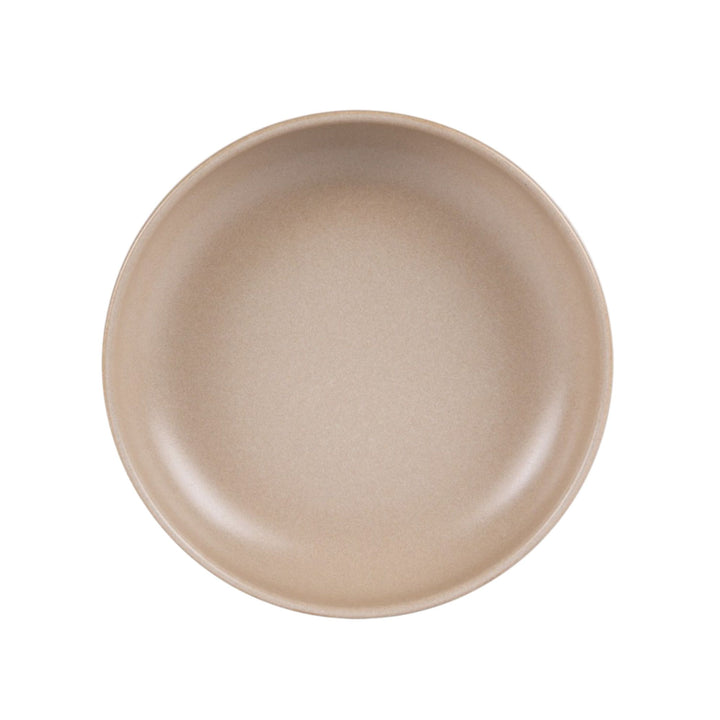 Top view of Uno Sand ceramic bowl highlighting its clean shape and warm tone.