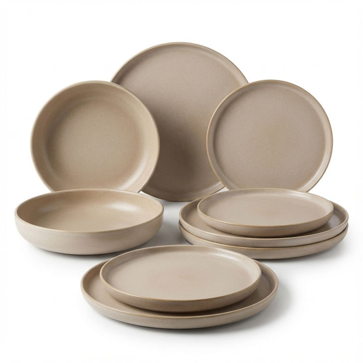 Set of Uno Sand ceramic tableware displayed together on a white background.