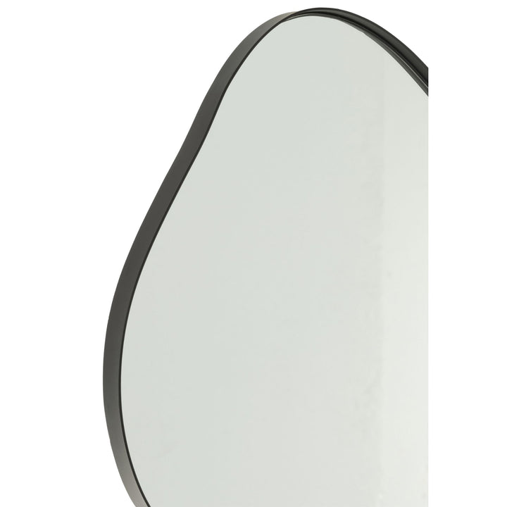 Close-up of Small black iron frame detailing on Utara Iron Mirror.