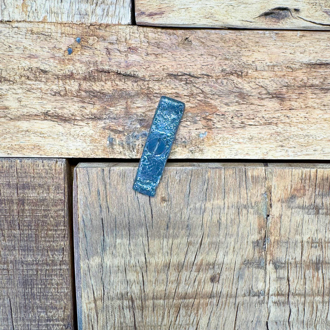 Close-up detail of reclaimed wood grain, natural marks, and aged finish.