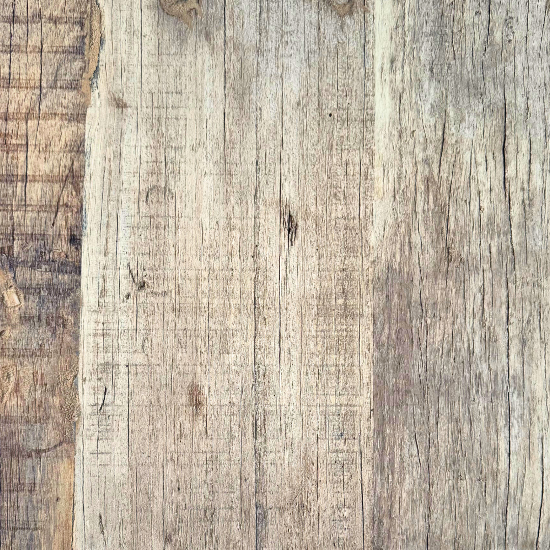 Close-up detail of reclaimed wood grain, natural marks, and aged finish.