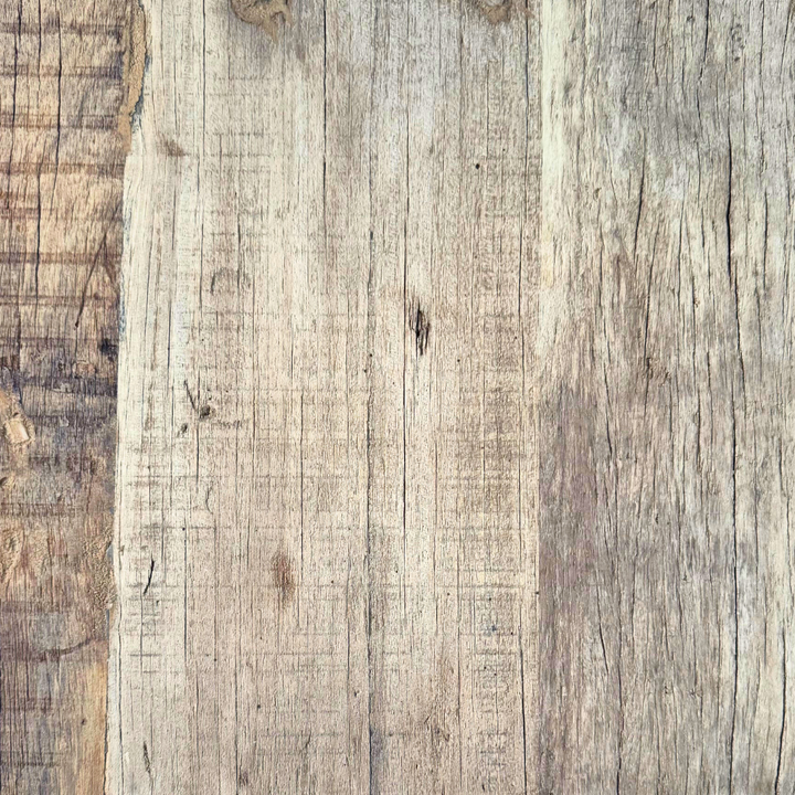 Close-up detail of reclaimed wood grain, natural marks, and aged finish.