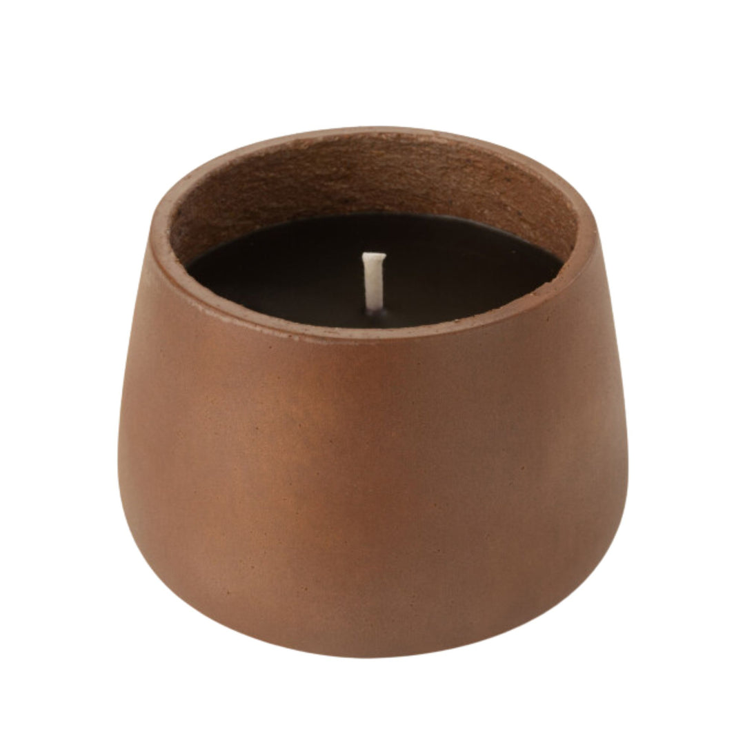 Front view of the Vamizi Brown Candle in a matte brown cement container.