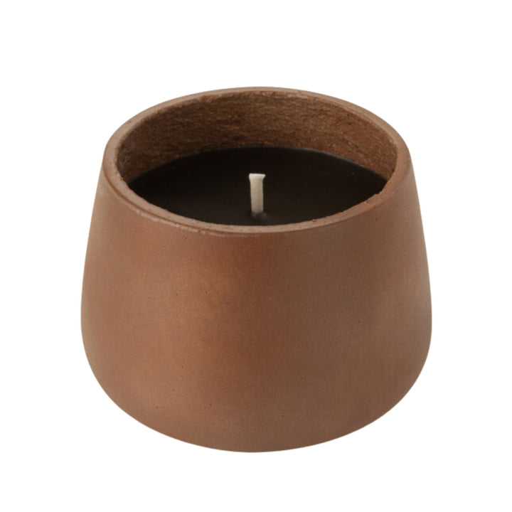 Front view of the Vamizi Brown Candle in a matte brown cement container.