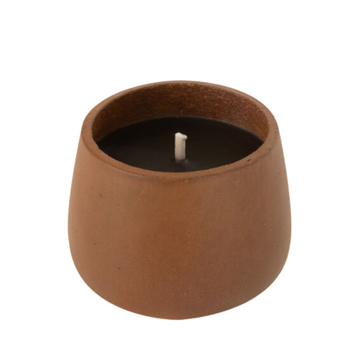 Front view of the Vamizi Brown Candle in a matte brown cement container.