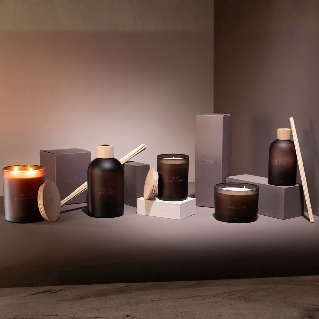 Lifestyle scene showing the Vanille Gourmande diffuser arranged with other scented products.
