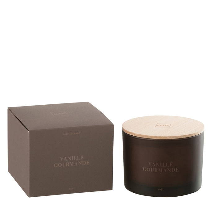 Front view of the Vanille Gourmande scented candle in dark amber glass with wooden lid.