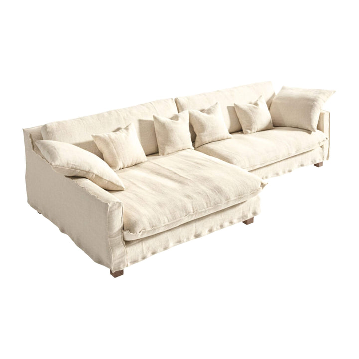 Full view of the Venezia sofa in white linen with extended chaise longue.