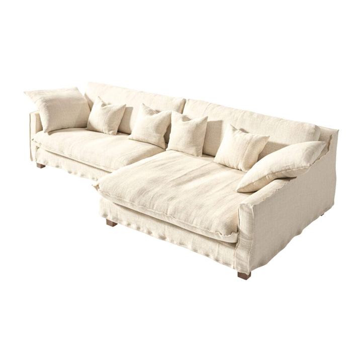 Full view of the Venezia sofa in white linen with extended chaise longue.