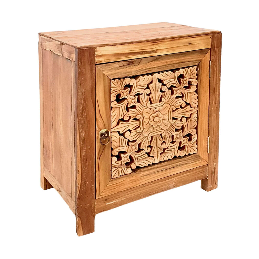 Angled view of carved teak wood side table showing cabinet depth