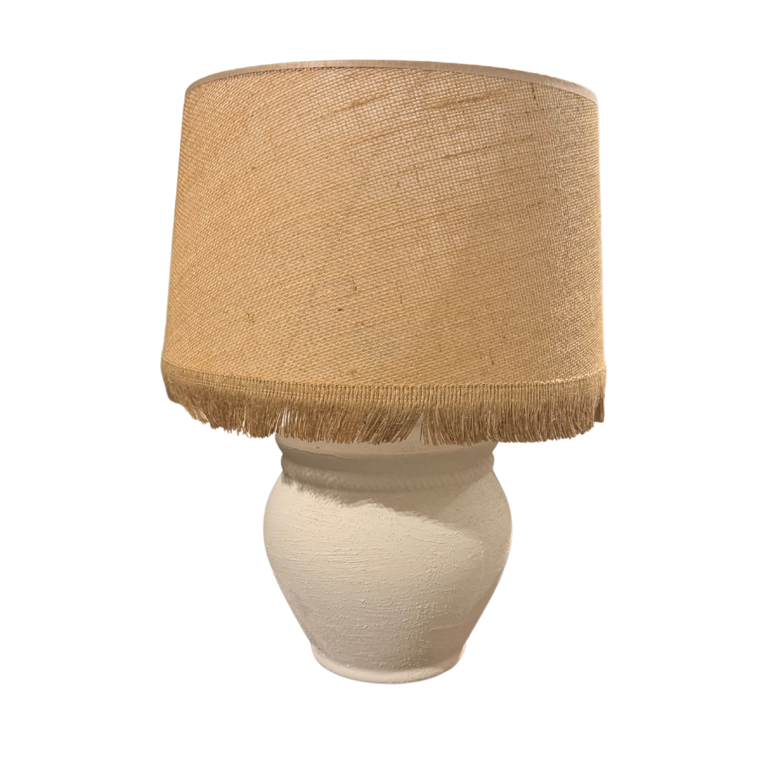 Vison table lamp with natural jute drum shade and white ceramic base.