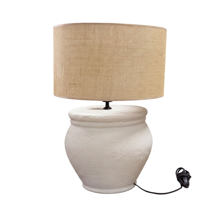 Front view of the Vison table lamp showing its textured white ceramic base and natural jute shade.