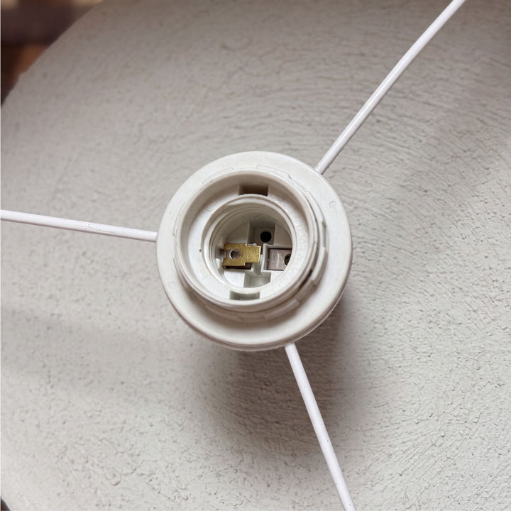 Interior view of the lampshade showing the bulb holder and supporting frame.