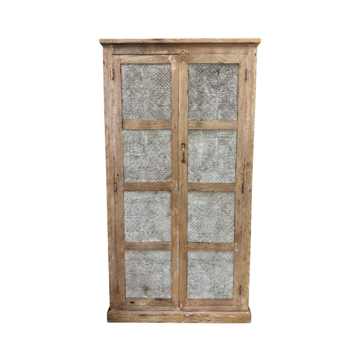 Front view of the White Briss teak wardrobe featuring framed doors with textured decorative panels.