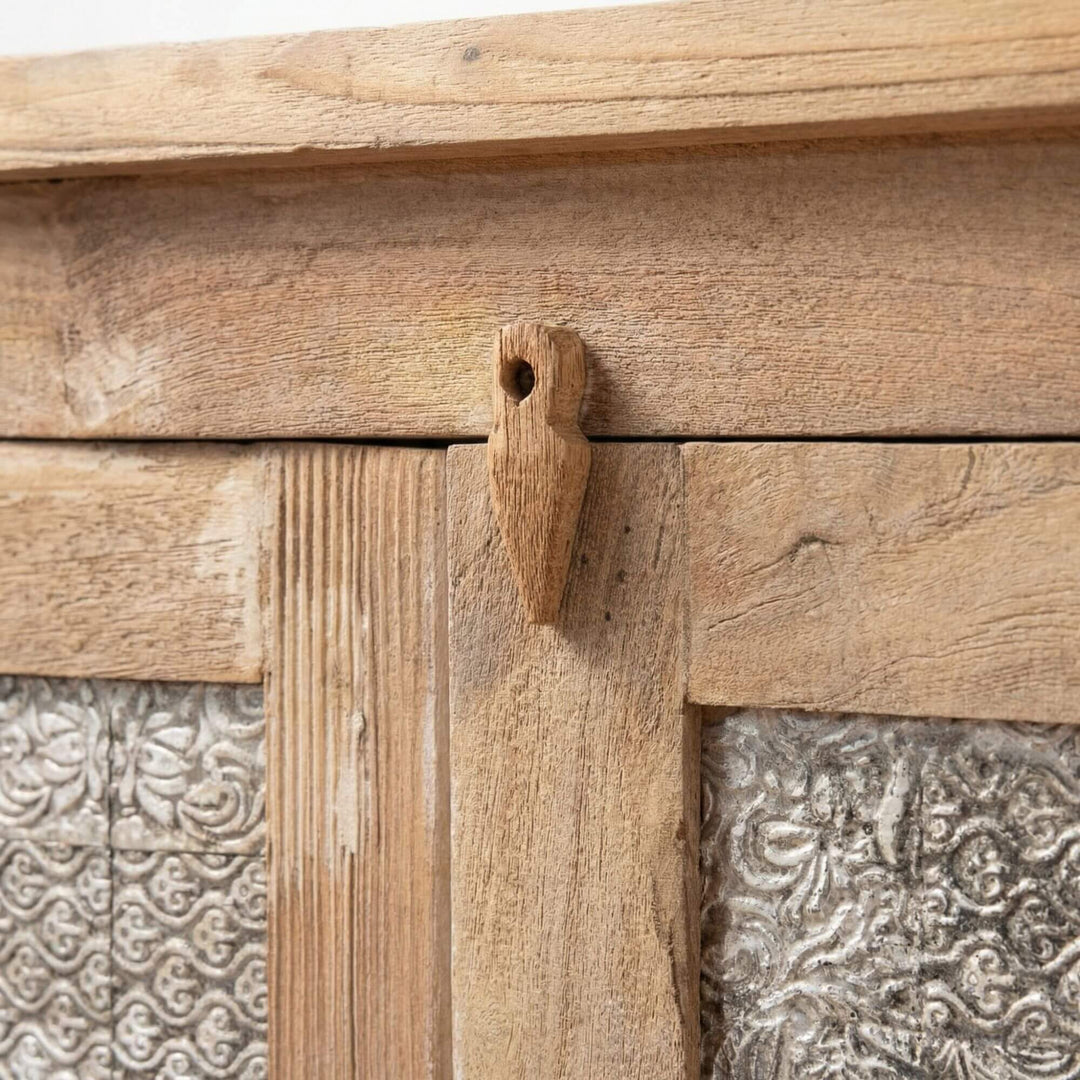 Close-up detail of the teak wood frame and door latch mechanism.