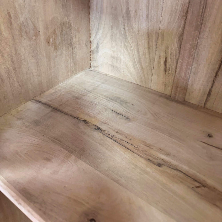 Interior wooden shelves of the White Briss Collection Wardrobe.