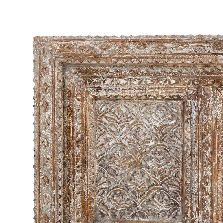 Close-up detail of the hand-carved reclaimed wood design and aged texture.