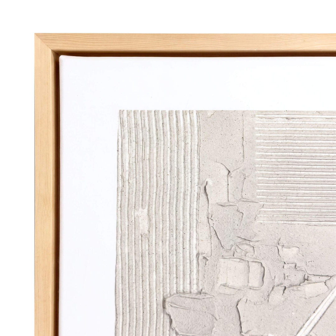 Close-up of the Woven Earth painting highlighting the sculptural ivory surface and natural wood frame