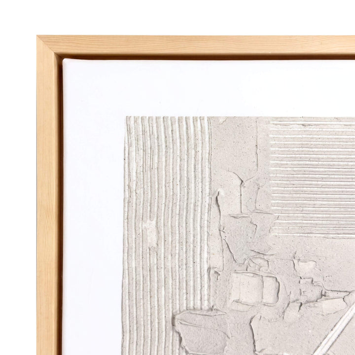 Close-up of the Woven Earth painting highlighting the sculptural ivory surface and natural wood frame