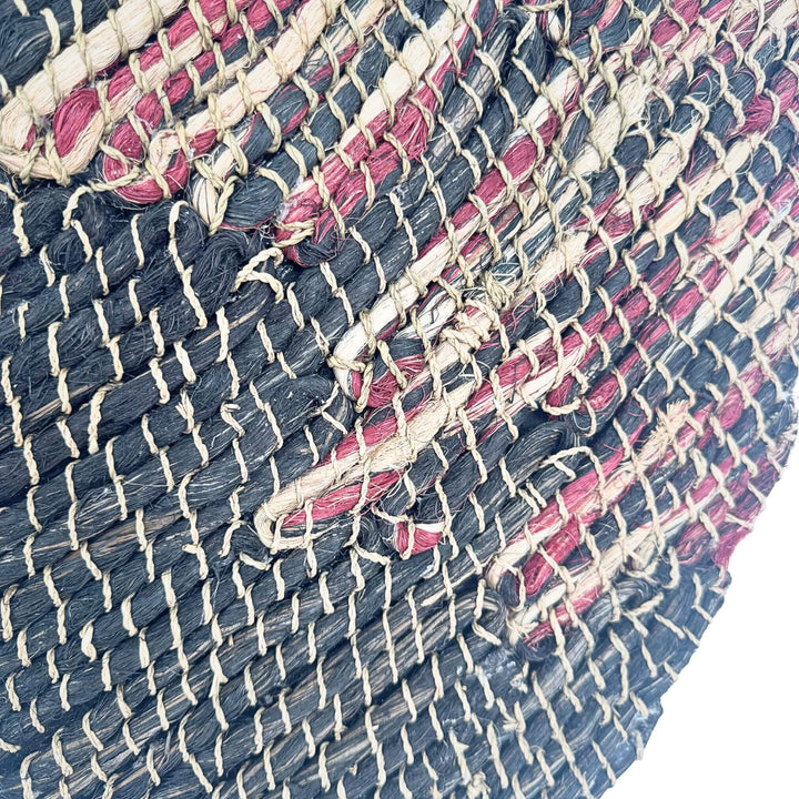 Close-up of Warna Wall Deco showing handwoven texture and color variations.