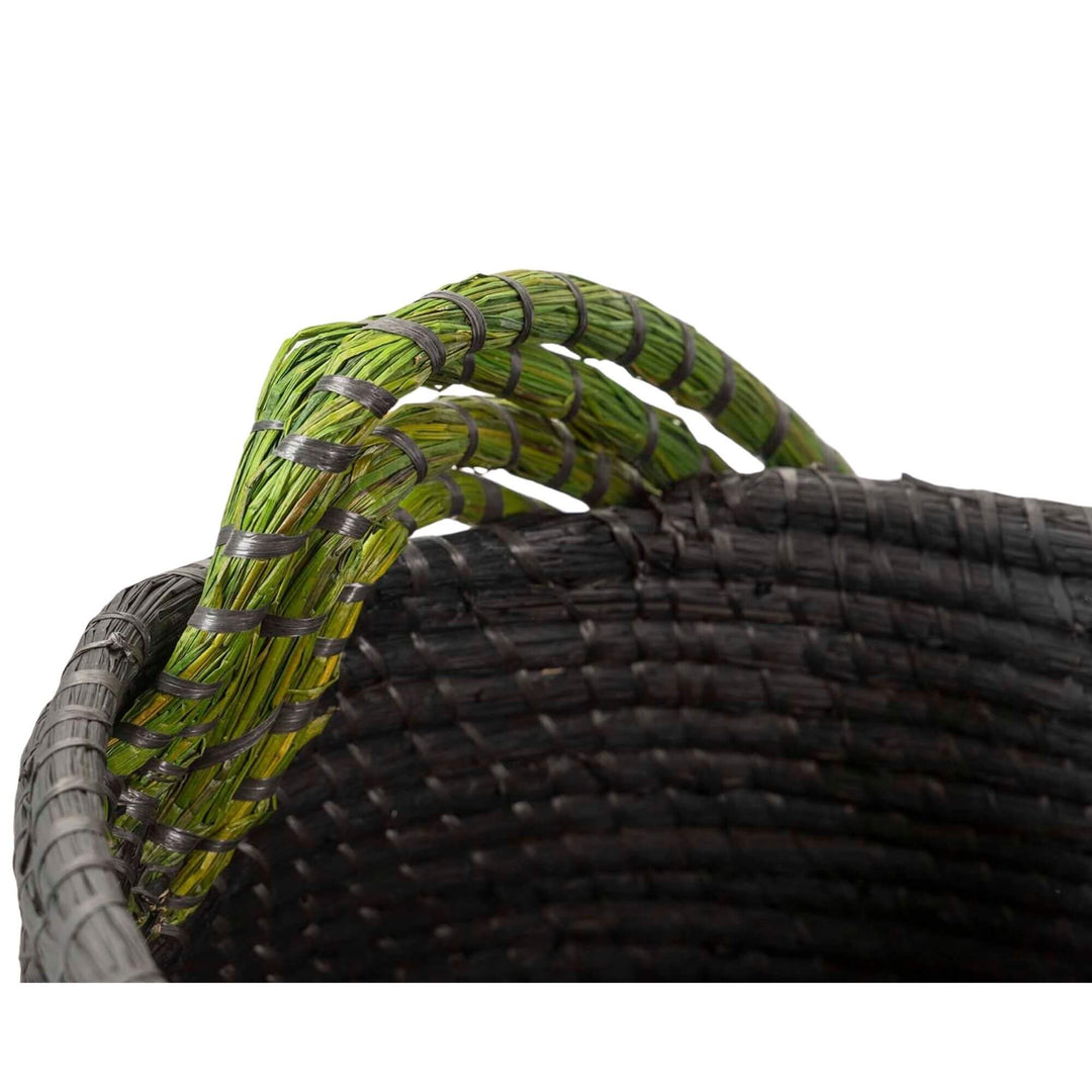 Close-up of Yachar Basket showing the green braided rim and woven detail.

