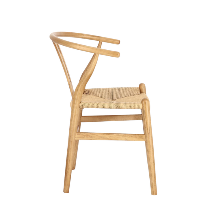 Side view of Yara dining chair in natural elm with woven paper-cord seat.
