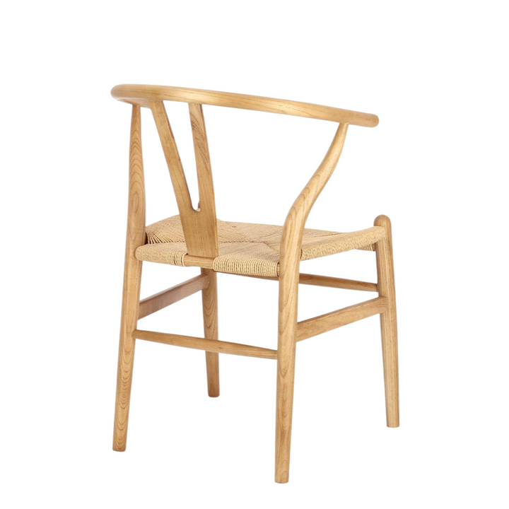 Angled side view highlighting curved backrest and sleek legs.