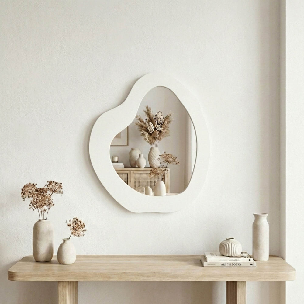 Styled interior setting featuring the Zinc Organic Mirror mounted above a wooden console table.