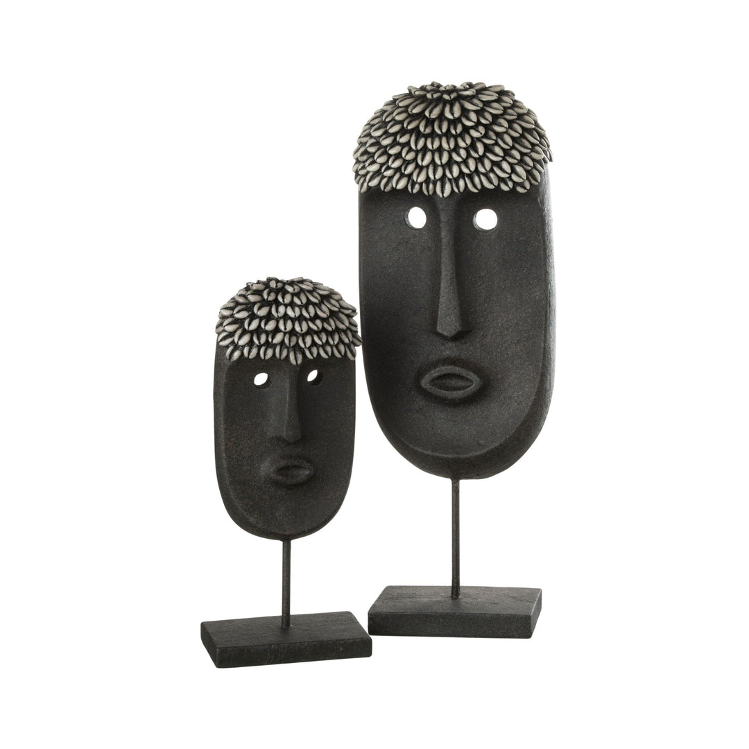 Zulu stand decorative sculpture made from wood with elongated tribal face design in dark tones.