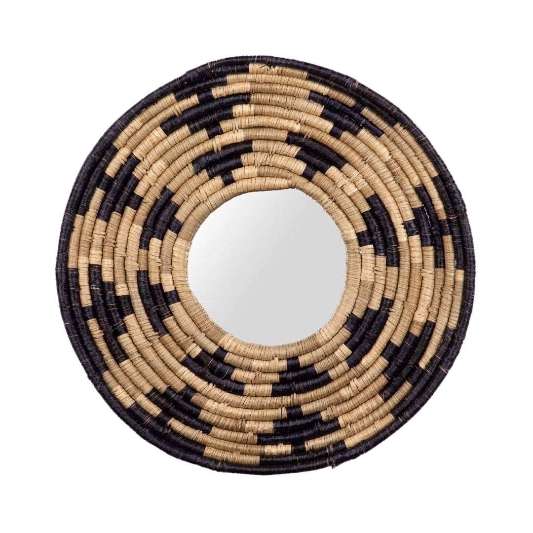 Front view of the Zuri Mirror I with a round handwoven seagrass frame in natural beige and dark contrasting tones