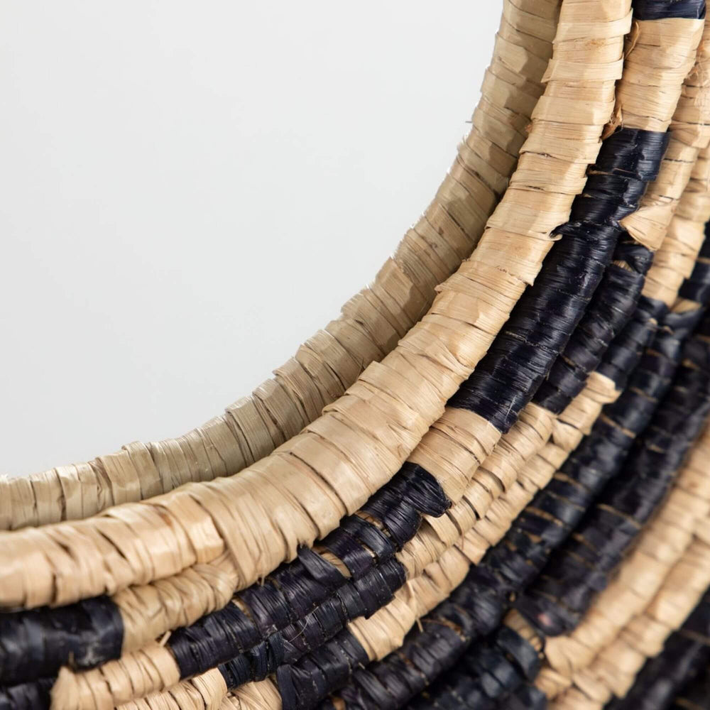 Close-up of the Zuri Mirror III highlighting the layered seagrass weave and bold concentric pattern