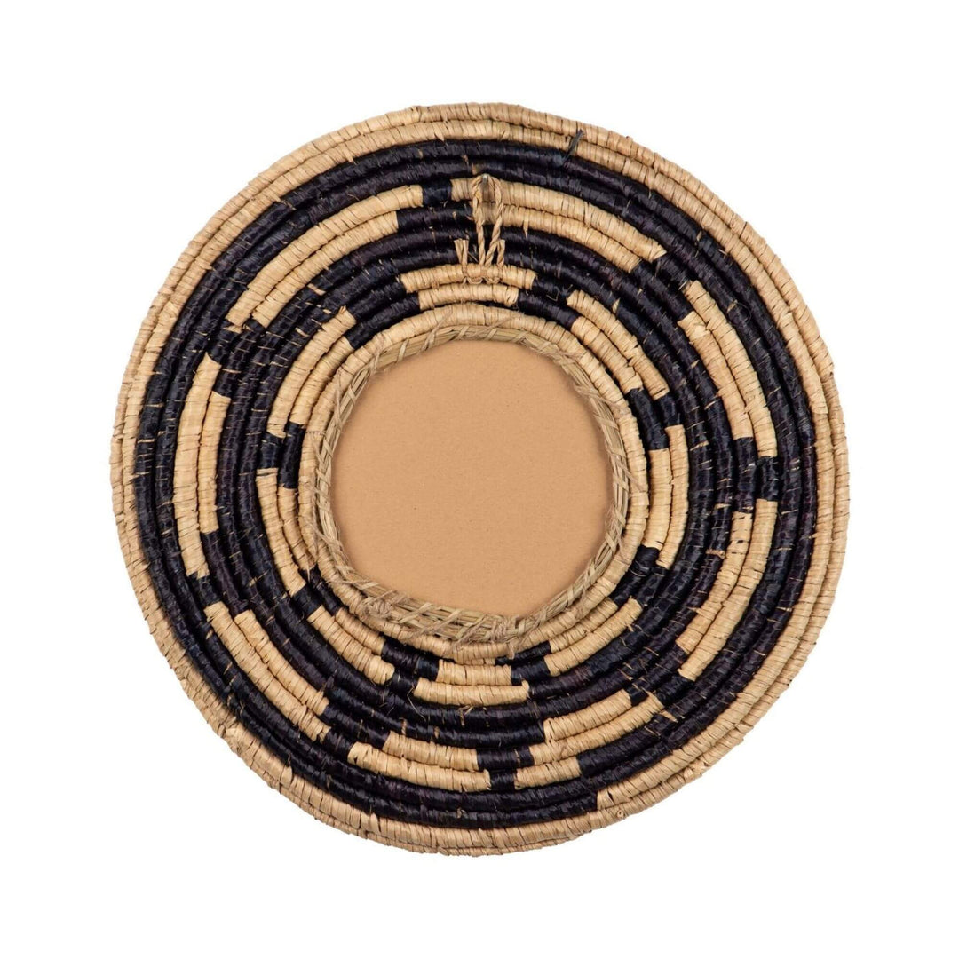 Rear view of the Zuri Mirror III showing its circular woven seagrass construction and central mirror backing