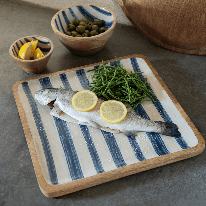 Lifestyle image displaying the Anaya Stripes Square Tray with food served.