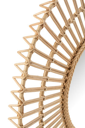Side detail showing the craftsmanship of the Banana Mirror’s rattan canes.