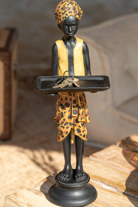 Marco Boy decorative resin stand featuring a stylized figure holding a tray with patterned clothing details.