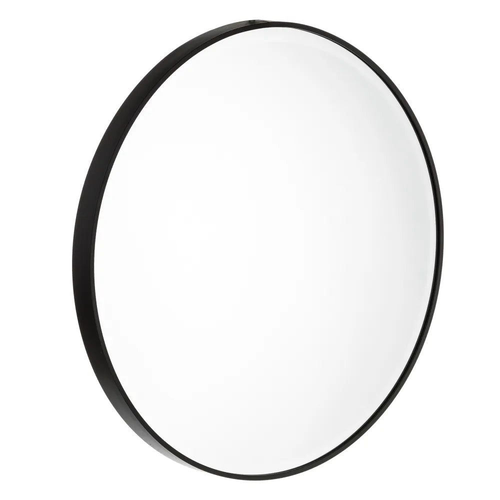 Angled view of the New York round mirror showing its slim black aluminum frame and clean circular design.
