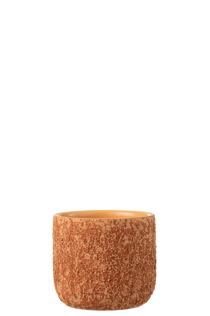 Front view of the orange rustic ceramic pot showing its rounded shape and textured surface.