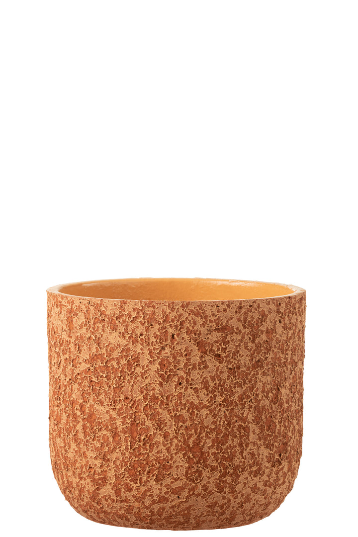 Front view of the orange rustic ceramic pot showing its rounded shape and textured surface.