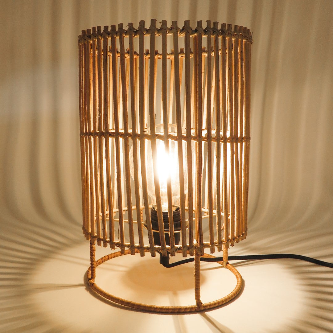 Small Sun Rattan Lamp lit, creating soft natural ambient lighting.