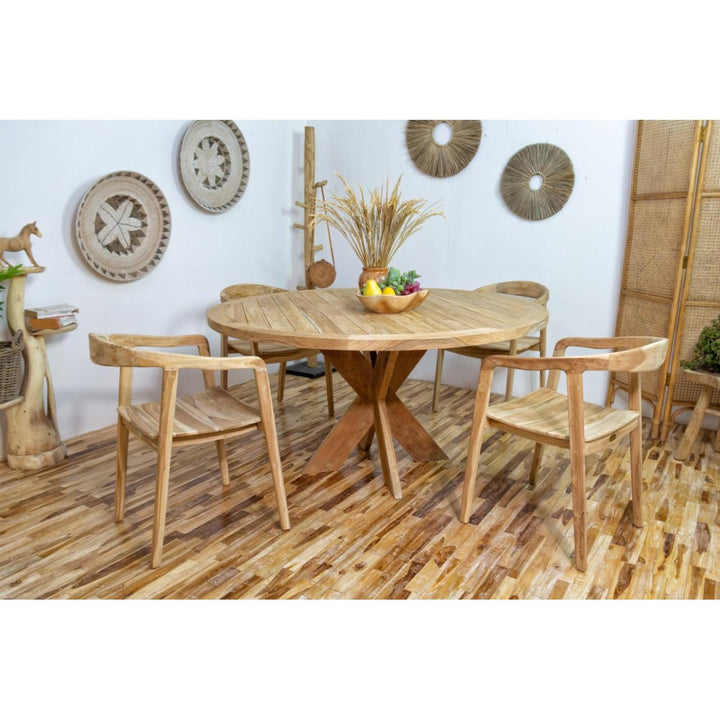 TONGARIKI dining table with chairs in a room with decorative elements.
