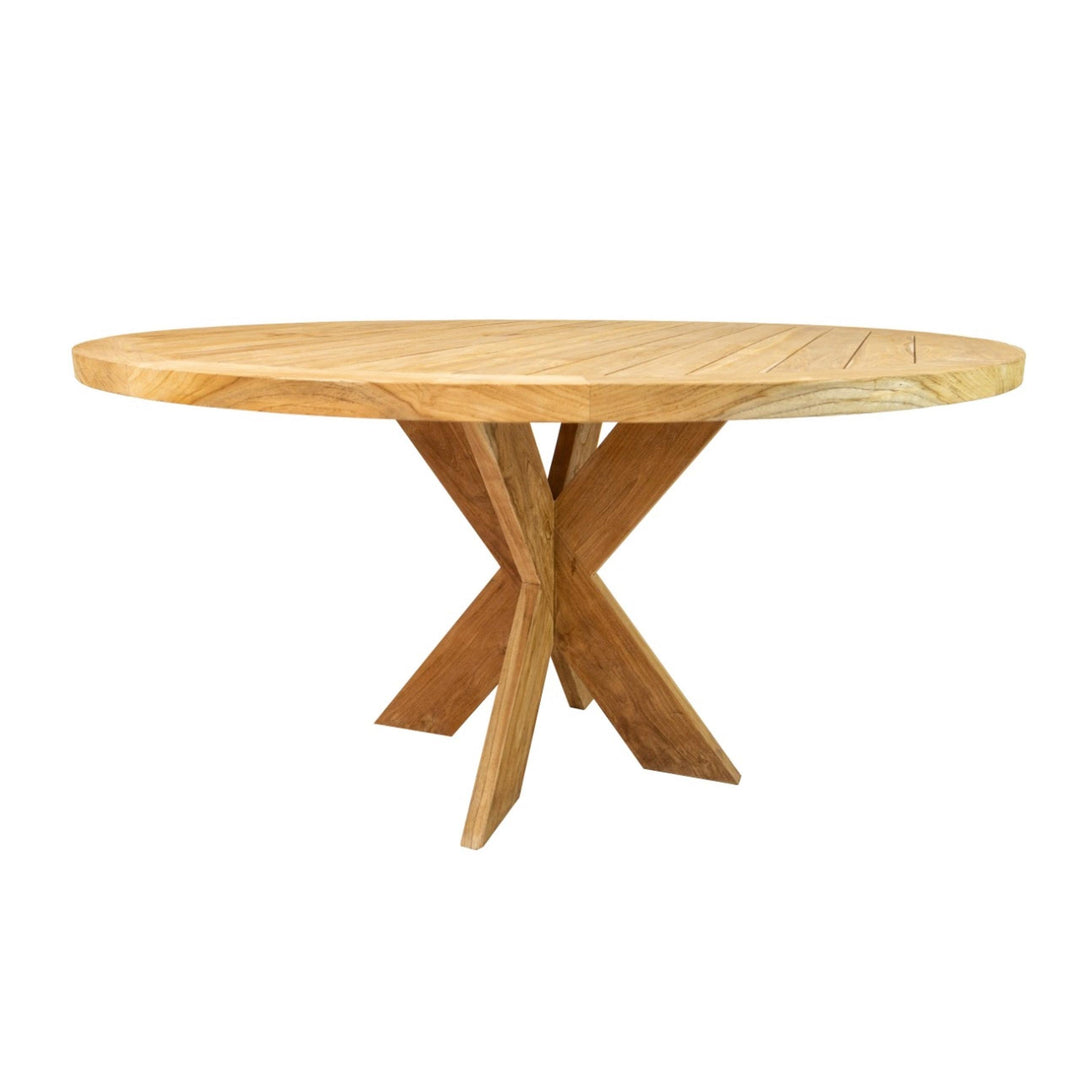 Side angle of the teak Tongariki table styled with dining chairs.