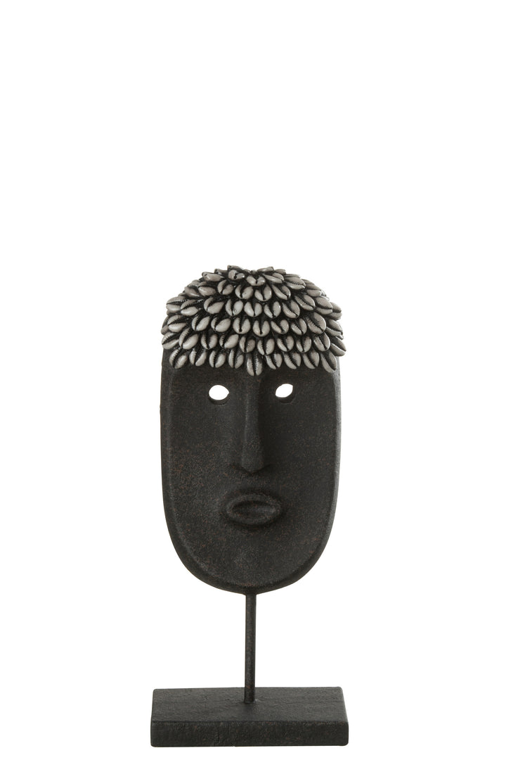 Zulu stand decorative sculpture made from wood with elongated tribal face design in dark tones.